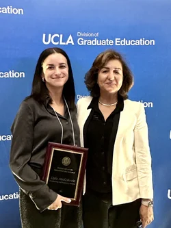 Laila Medzikovic stands with Dr. Eghbali, celebrating her award.