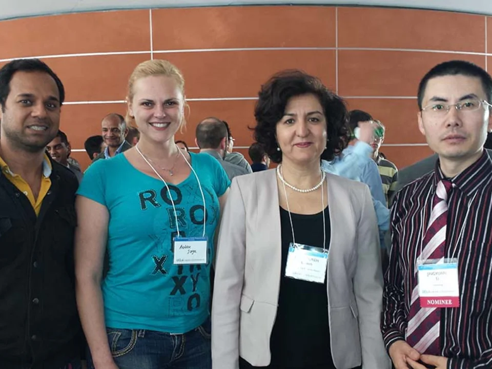Dr. Eghbali and other researchers at conference.