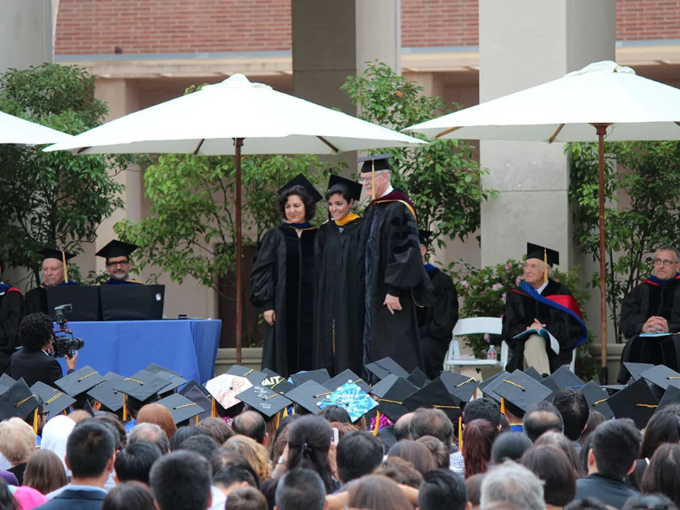 Graduation ceremony audience and faculty in robes